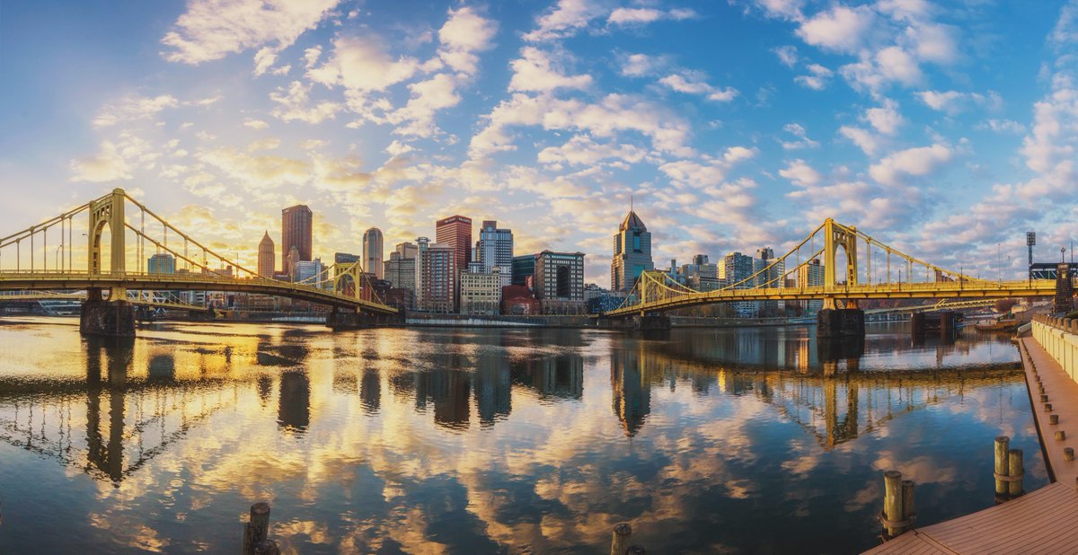 A beautiful golden glow emanates from behind the #Pittsburgh skyline where the sun would eventually rise over the city, illuminating the low clouds and creating an incredible view from Allegheny Landing on the North Shore