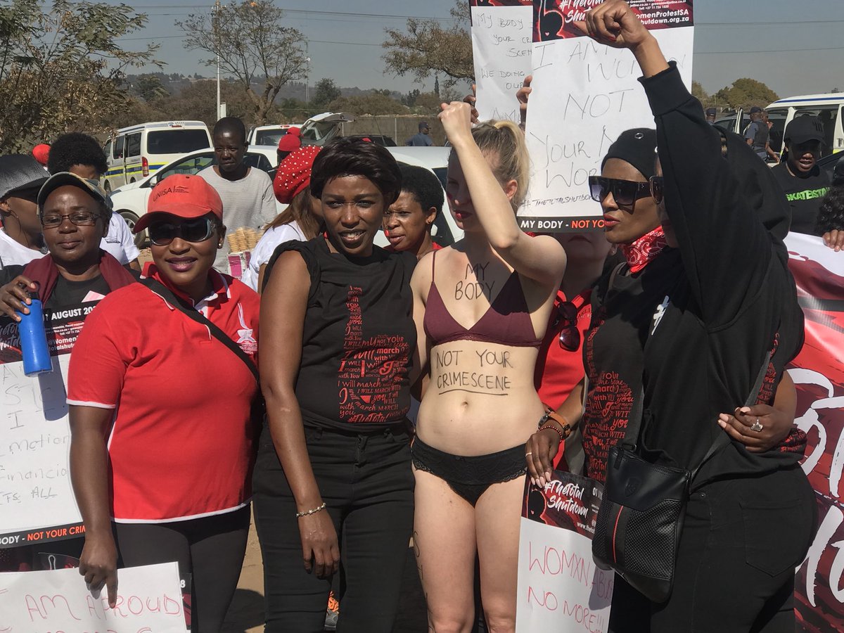 TeamNews24's tweet photo. A woman in underwear with the words: My body, not your crime scene, written on her body  #TotalShutdown (@AlexMitchley) https://t.co/Q4h4rwR282