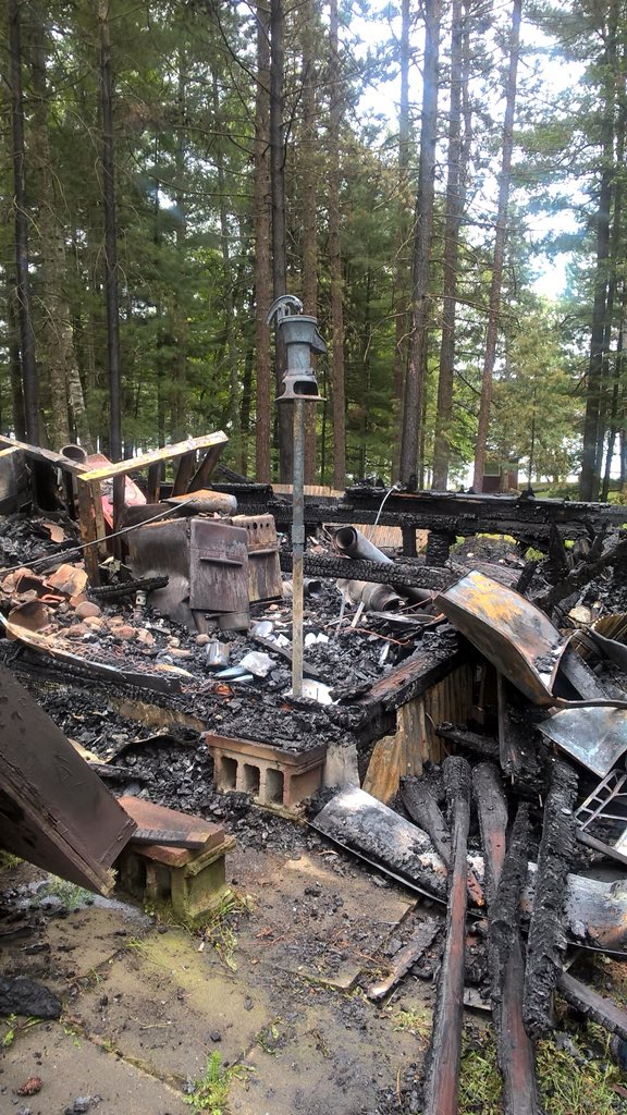 jerberg424's tweet photo. Crazy night at the cabin. Big lightning strike burned down the cabin next door. Fire Dept got it out at 2am. Strange to see the water pump standing alone. https://t.co/9sOtwDLv5j