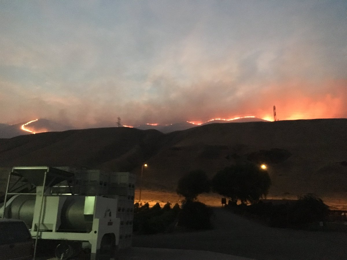 keaton_thomas's tweet photo. These photos come from Craig Leuthold, owner of the Maryhill Winery. They show the #MilePost90Fire as it reached the top of a nearby ridge line. The fire reached the edge of his vineyard, but he says nothing was damaged. #LiveOnK2 https://t.co/ODgnrHMFWr