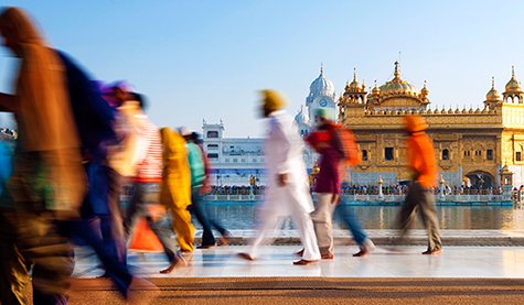 people walking in front of the Taj Mahal