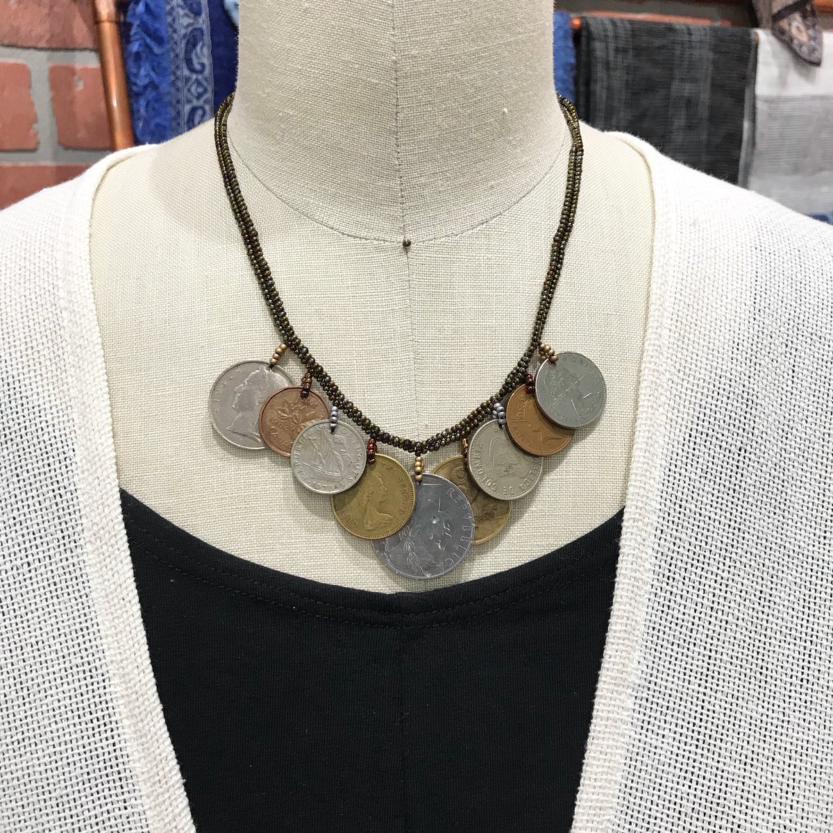 FairTradeDecor's tweet photo. NEW in store! This fun and distinctive necklace is made from Czech and Japanese beads with a touch of coins collected worldwide. Handcrafted in Guatemala, these pieces are sure to add a little dazzle to your day! https://t.co/q14CEPiIXY