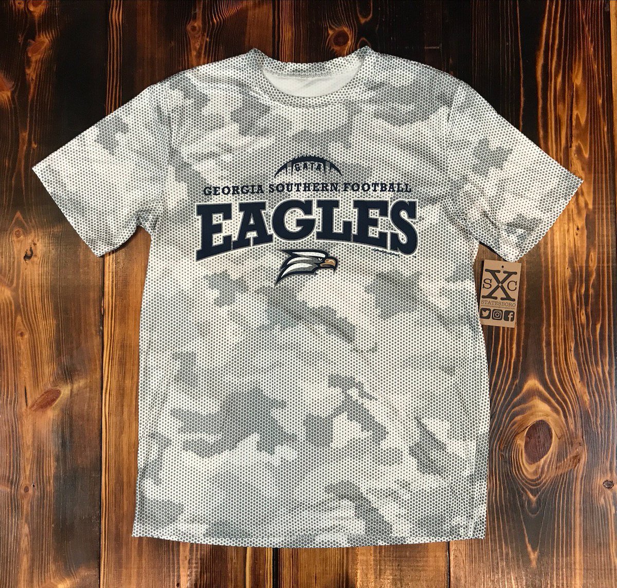 SXCStatesboro's tweet photo. Youth Performance Football Tee. What in the world? This is slick. Should we do an adult version too? What do you think? Just 30 Days til kickoff! #GATA #MoreCoolStuff #HailSouthernAndNoPlaceElse https://t.co/C1VQQTBXmH https://t.co/F69i07V2vb