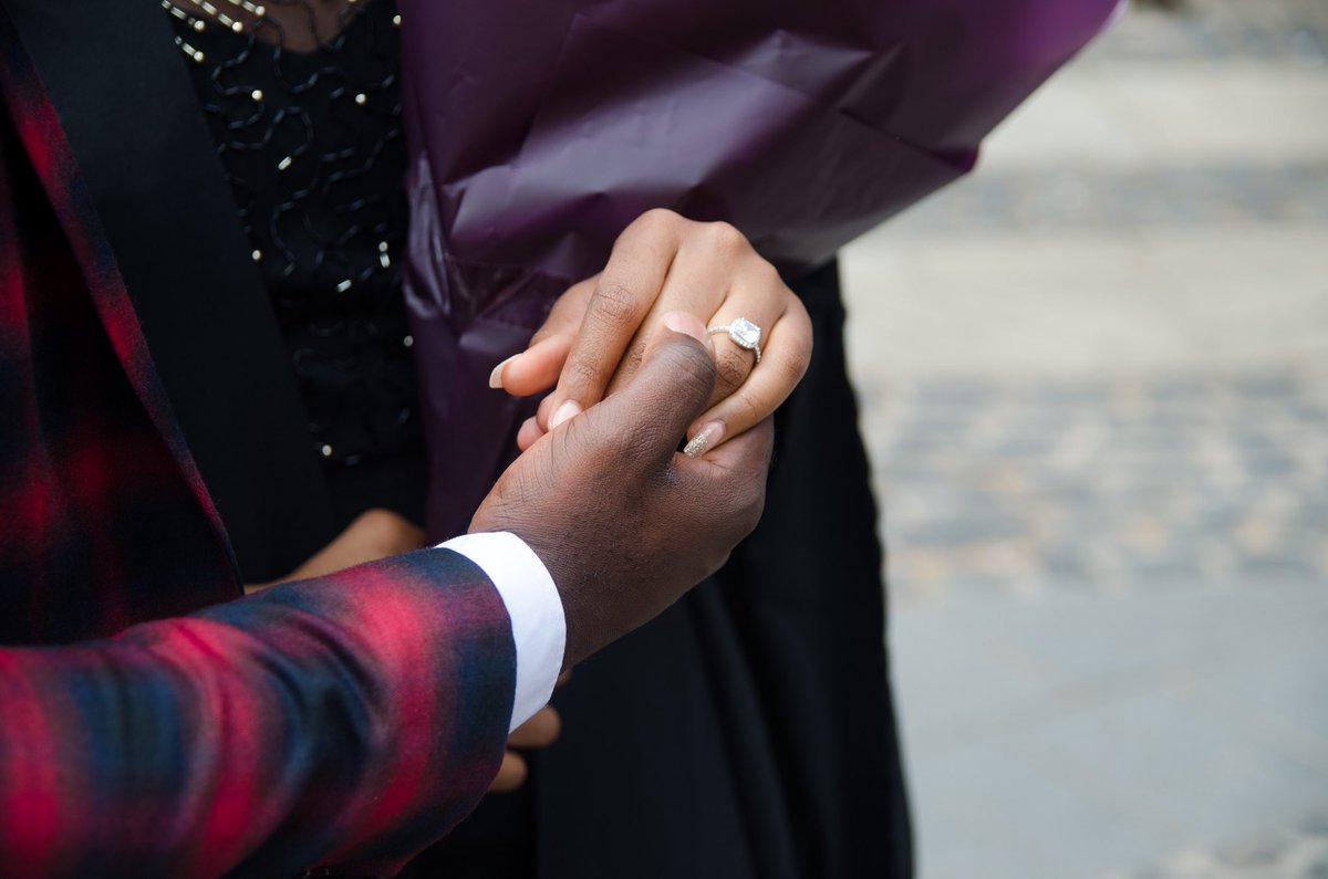 uncSnoopy's tweet photo. Did a Grad shoot and this happened!! 💍👏🏾 #DoubleCongrats! https://t.co/e7ocCG2w5R