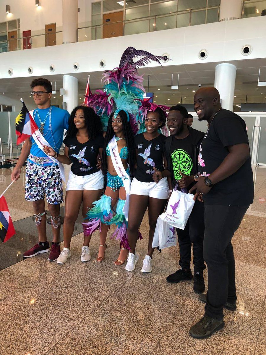 iflycaribbean's tweet photo. We're proud to be the Official International Airline of Carnival in Antigua & Barbuda. We were at V.C. Bird International Airport in Antigua earlier today welcoming passengers with giveaways and pre-Carnival festivities. #iflycaribbean #hellocaribbean #antigua https://t.co/pgq6FgyLSi