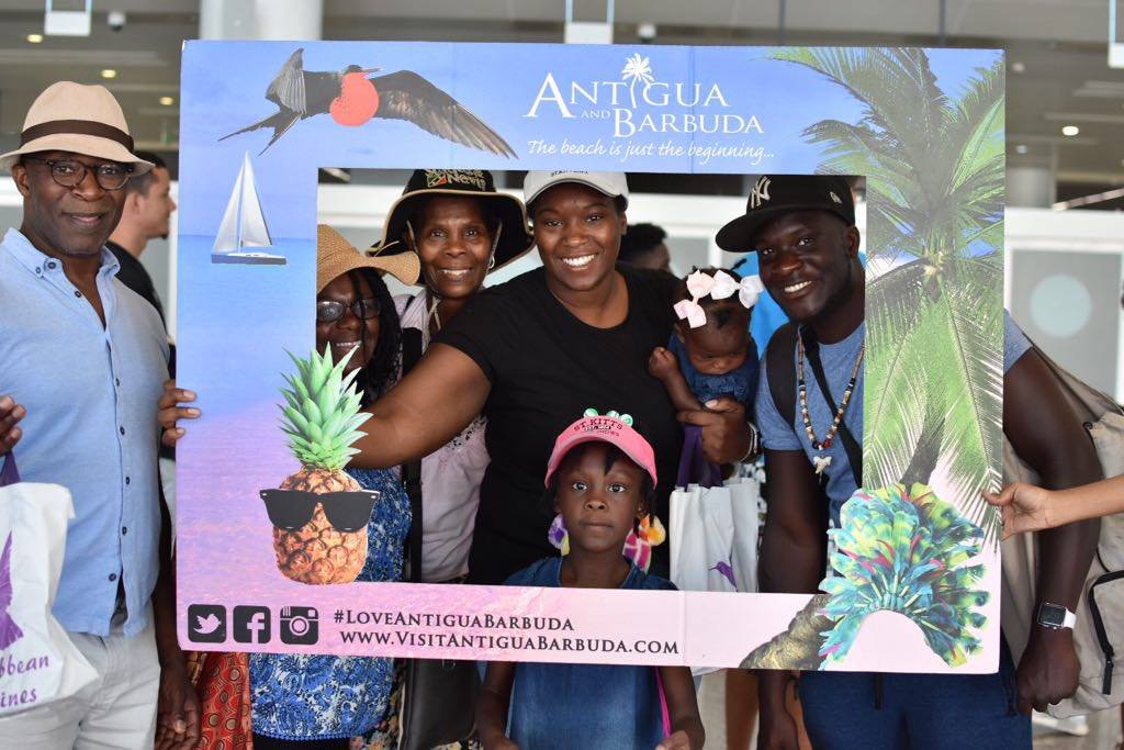 iflycaribbean's tweet photo. We're proud to be the Official International Airline of Carnival in Antigua & Barbuda. We were at V.C. Bird International Airport in Antigua earlier today welcoming passengers with giveaways and pre-Carnival festivities. #iflycaribbean #hellocaribbean #antigua https://t.co/pgq6FgyLSi