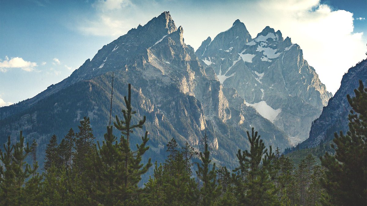 KogallaLLC's tweet photo. "Le Trois Tetons" The Shoshone-Bannock people called these mountains "Teewinot," which literally means "Many Peaks." The homesick and love sick French trappers called the most prominent peaks, "Le Trois Tetons," meaning the Three Breasts. https://t.co/uJzd5jTk1L