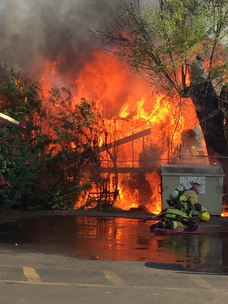 ChandlerFirePIO's tweet photo. In late afternoon heat on the first day of August, crews battled a debris fire that had spread to a vacant home. One of our newest firefighters helped to put out the blaze!  Thanks to Jack and all the crews for their quick response! https://t.co/hje6RkJItk