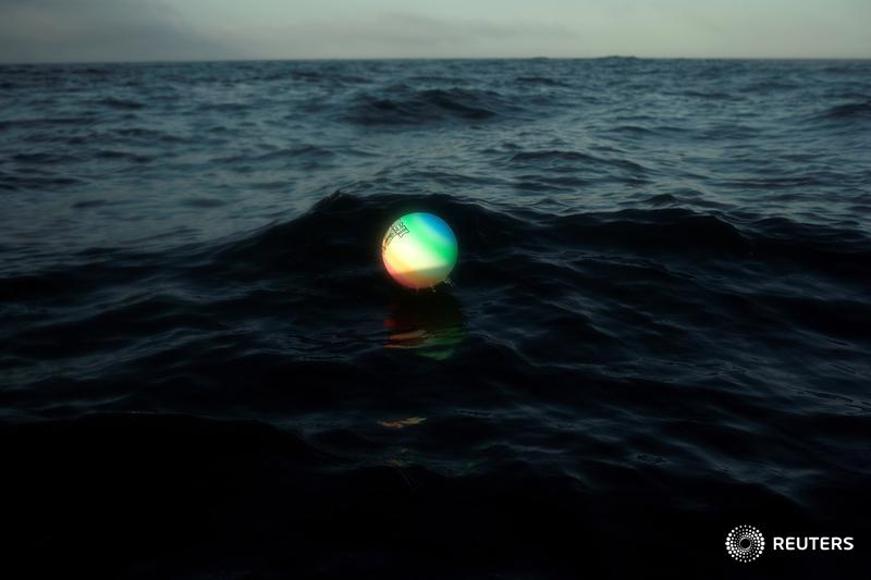 A plastic volleyball is seen floating in the Strait of Gibraltar, near Barbate, southern Spain