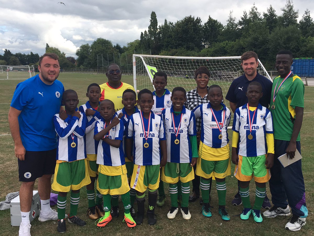 CFCYouthAcademy's tweet photo. During today's @NBFootball Britannia Cup, there was an U9 team on tour from Uganda in a few mixed and match shirts...

It felt the right thing to do to give them a Chester FC kit to remember their visit.

#FootballFamily https://t.co/LrWRIrMxzf