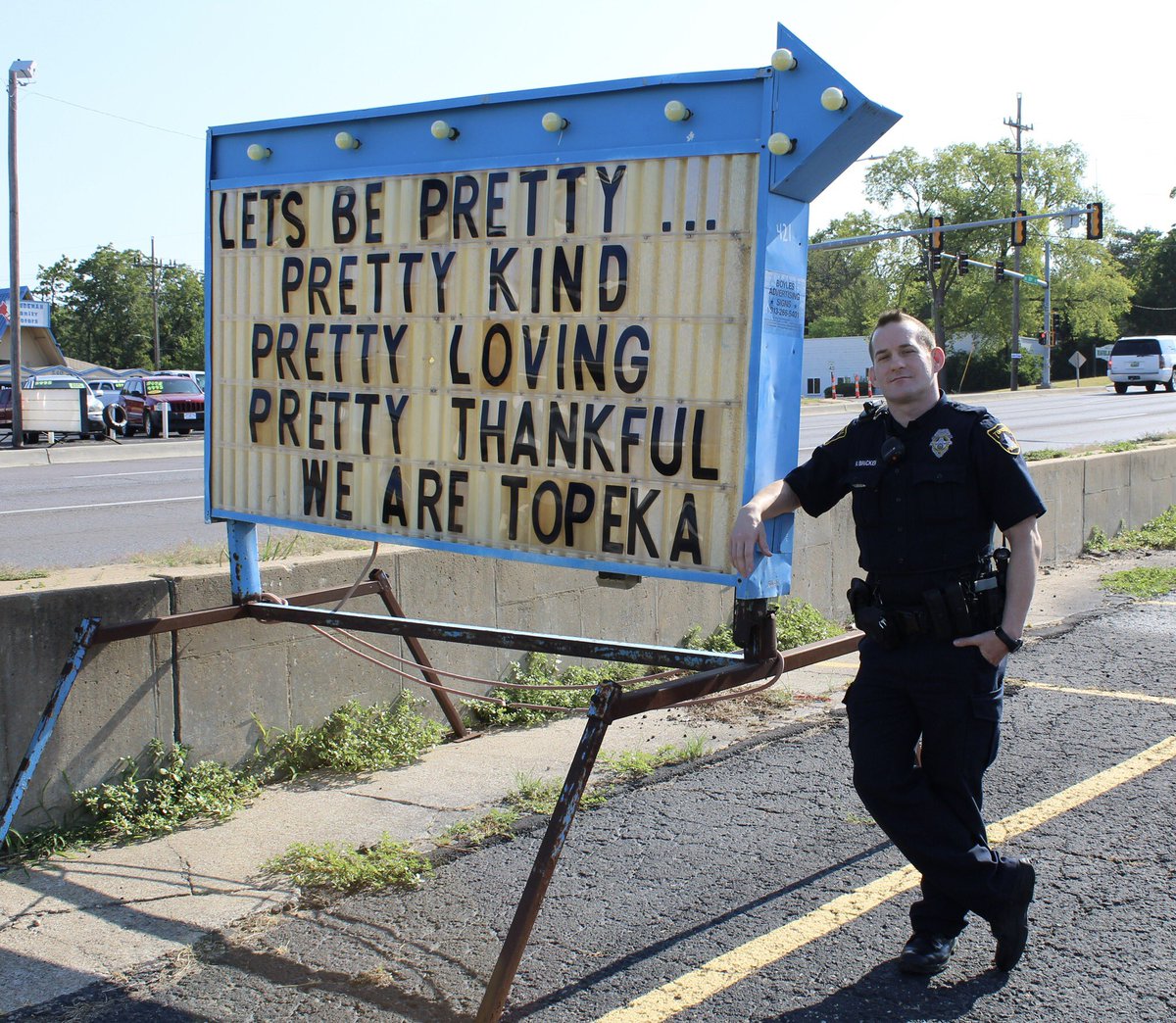 Topeka_Police's tweet photo. Friday positivity! We saw this sign and wanted to share the message! Officer Bracken is a community police officer and works in SE Topeka where the sign is located. 

If you’d like to get to know your community police officer, click here: https://t.co/7QjRE0Iul9 https://t.co/8KiNm3oT0C