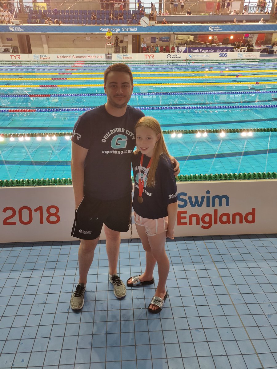 guildfordcitysc's tweet photo. Connie with her Coach Matt & her BRONZE Medal! #FirstNationals #FirstMedal #PocketRocket #SESwimming @tyr_uk https://t.co/Zlhv5yULQS