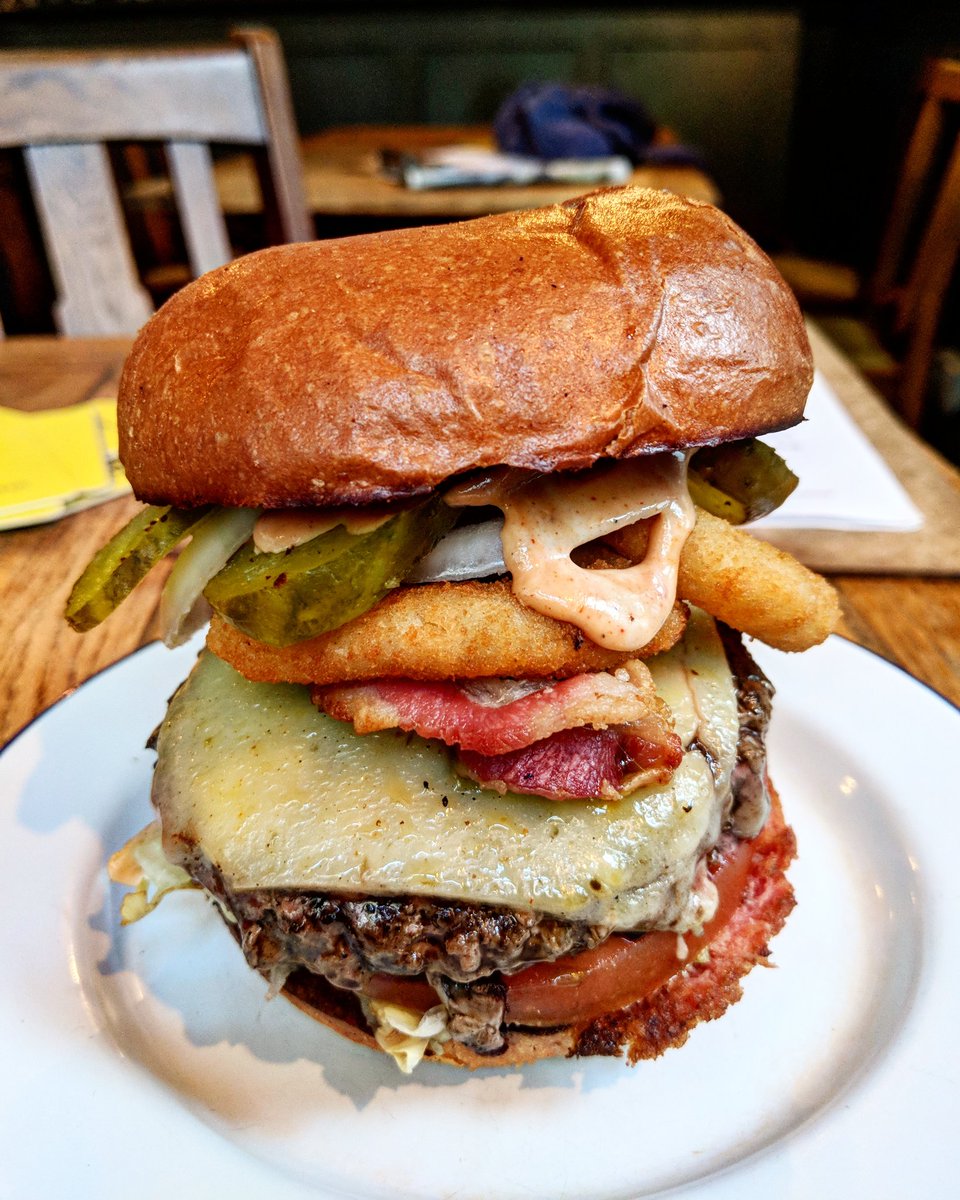 LondonPopups's tweet photo. A monster... The stunning Texas 🍔 from @planetpattyuk at @DukesHighgate Beef patty, onion rings, smoked bacon, cheese... Serving daily! https://t.co/AVpWROGW3h