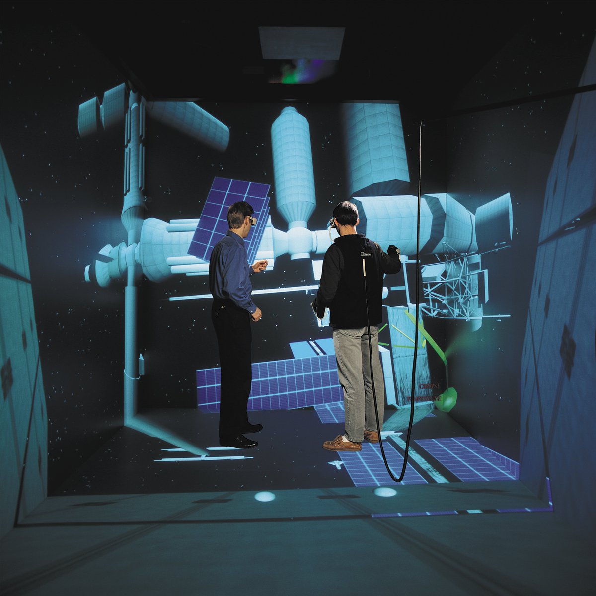 mechdyne's tweet photo. #FlashbackFriday to the year 2000, when this photo was taken of our Mechdyne teammates inside of a CAVE system. These systems allow for multi-user collaboration within a fully immersive #VR environment. Curious to learn more? https://t.co/QvudQngr6L https://t.co/NC9WjYCEIX