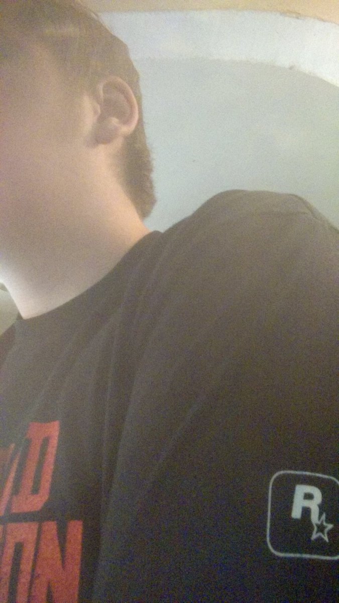 LukeChenier's tweet photo. @MrBlueDeadpool I don't know @RockstarGames @LegacyKillaHD Looks very similar to a tee you released 8 years ago... Just with less words, less detail in the logo, and no Rockstar stamp on the sleeve. Hopefully the game won't take the same fate. https://t.co/bcjCCP2QSC