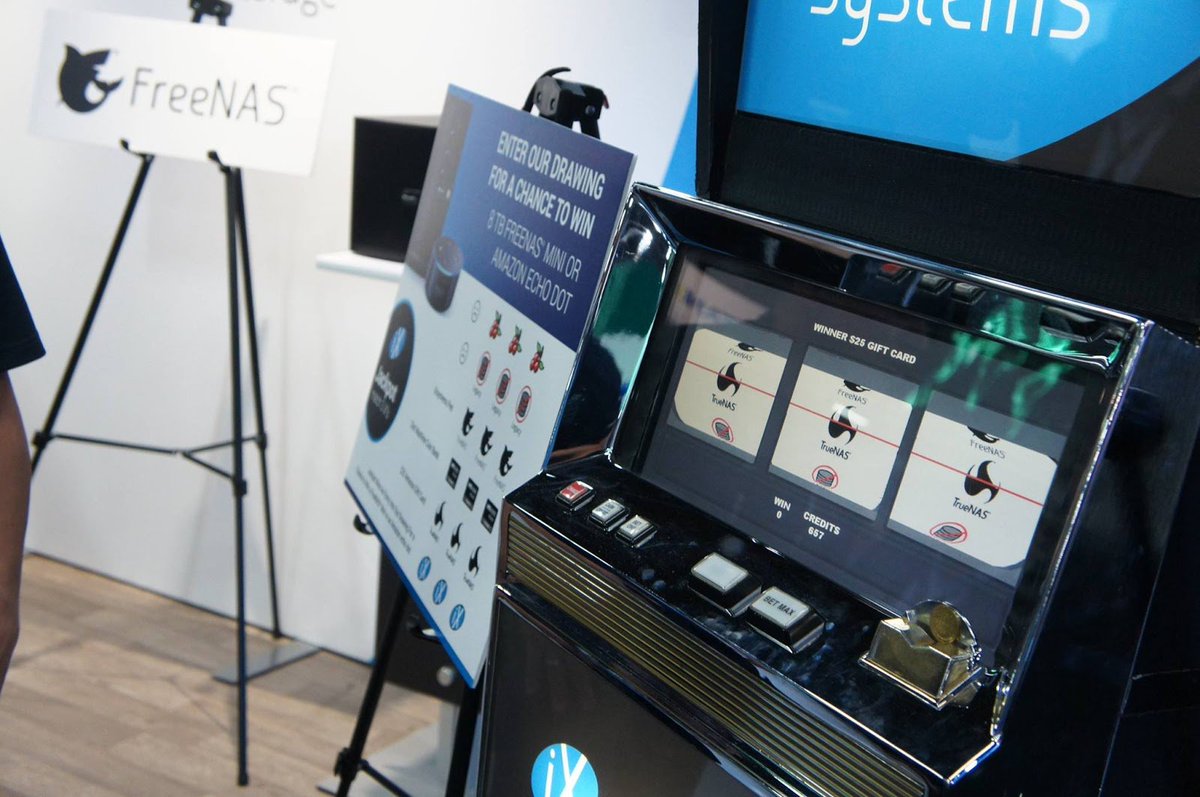 TrueNAS's tweet photo. Who’s excited for @VMworld 2018? We’ll be at Booth #2224 at #VMworld 2018 in a couple of weeks! Take a look back at our booth from last year’s event! Stay tuned, exciting announcements coming soon! #OpenSource #FlashbackFriday #iXMag #SlotMachine https://t.co/jm7imiKGGQ