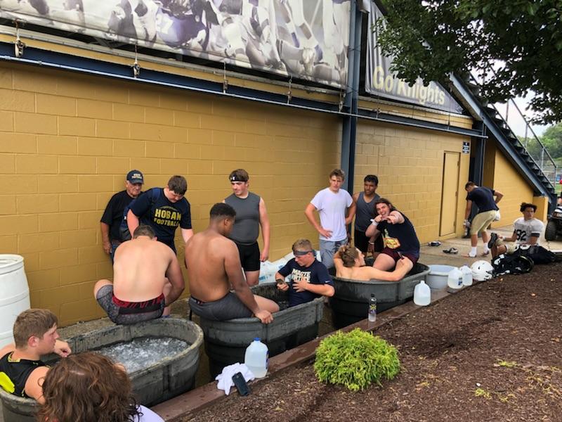 coach_wink55's tweet photo. After a hard working and hot practice, the boys @HobanFootball needed to get in that ice bath and let their bodies recover!!! Thank you @Shane__Hamm7 for bringing in your horse troughs! #WorkHardRecoverHard
#BeastMode https://t.co/Ey6IMh3Jiz