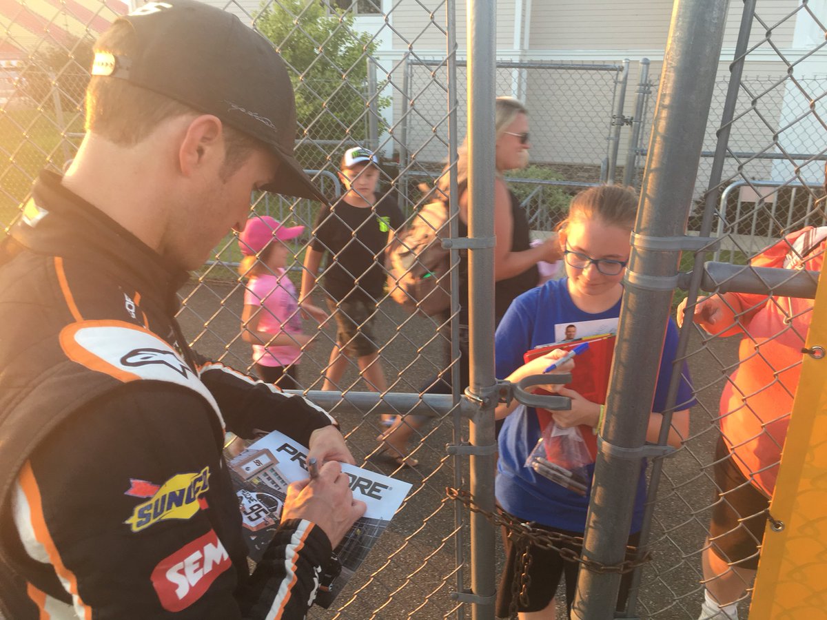 .@kaseykahne makes sure his young fans know that #KidsDriveNASCAR - stops after qualifying to sign autographs for numerous youngsters at @WGI #NASCAR