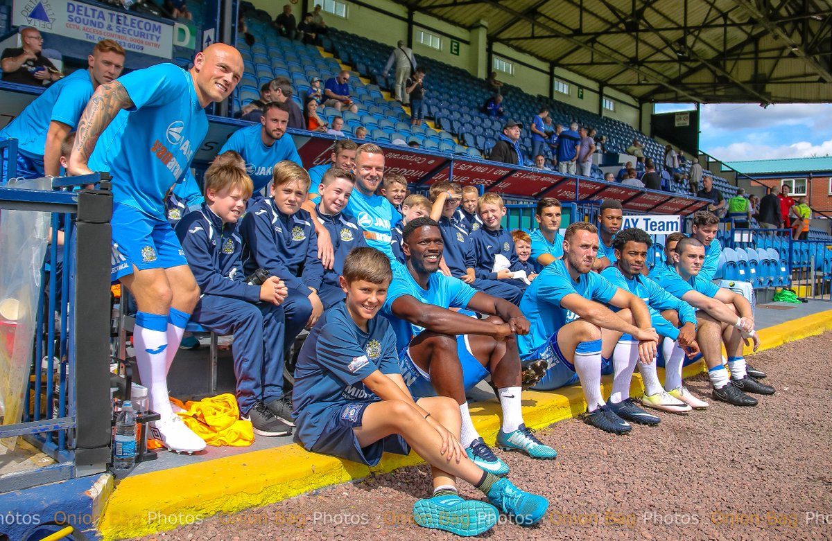 TheOnionBag1's tweet photo. Lovely touch from the @StockportCounty players to take the time to go and sit with the ball boys pre-match before todays game v @FCUnitedMcr -  class ! https://t.co/XU2nIBBv6Y