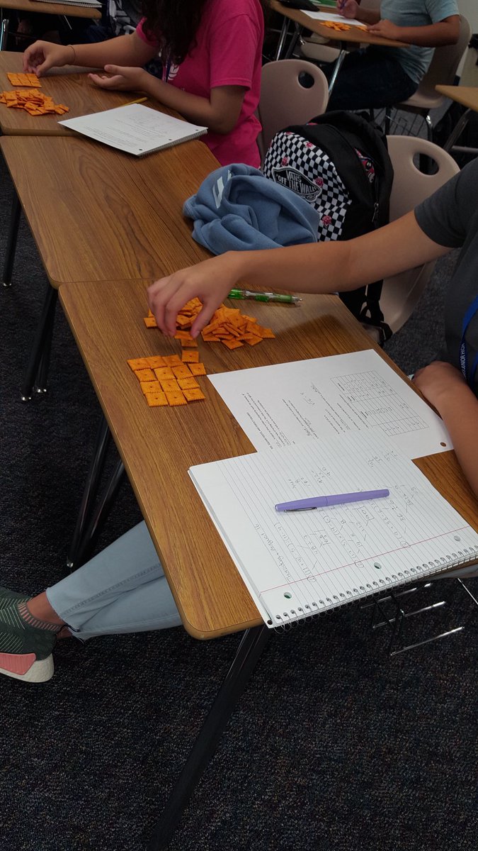 trisharey's tweet image. SLJH 8th grade math students learning about squares and square roots with Cheez-its. #7LJHpride #katymodelsmath @spartan_speak