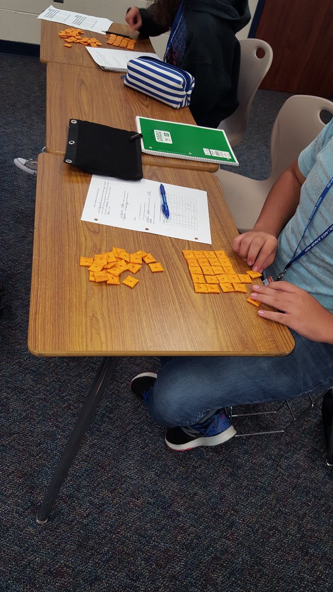 trisharey's tweet image. SLJH 8th grade math students learning about squares and square roots with Cheez-its. #7LJHpride #katymodelsmath @spartan_speak