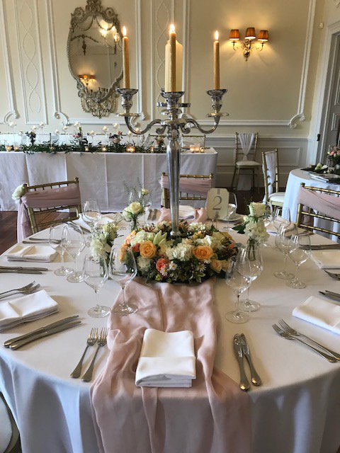 Pale pink chiffon drapes used as runners with beautiful silver candelabra and a gorgeous floral display around the bottom really does ooze elegance. We are just in love with this set up we did at Rudby Hall in June. The stunning flowers were done by Karen Bainbridge. #teesside