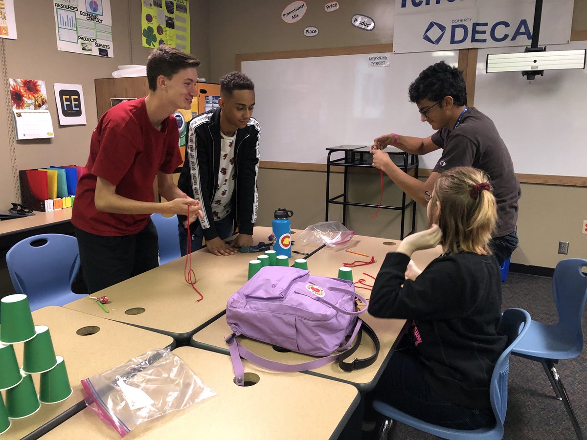 DecaDoherty's tweet photo. Doherty Entrepreneurship students thinking on their feet today creating cup towers using string and rubber bands. Communication, design, and teamwork. Proud of these aspiring entrepreneurs working together to become #emergingleaders #doherty #cte #d11 #coloradodeca #dohertydeca https://t.co/hpHoVHev6O
