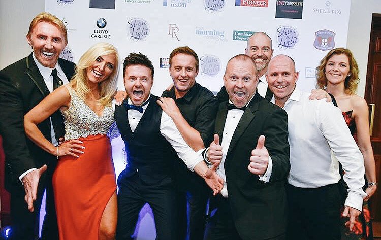 **GUESS WHO!!**

Who’s this year’s Shine A Light Ball host or hostess.?

Is it..
Nik or Eva <a href="/thespeakmans/">Nik & Eva Speakman</a> 
<a href="/MrLeeBrennan/">Lee Brennan</a> <a href="/jimmyconstable/">RTFKT</a> or <a href="/MrSpikeDawbarn/">Simon'Spike'Dawbarn</a> from <a href="/911official/">911</a> 
Emmerdale Star - <a href="/Stuartwade/">stuartwade</a>
Brookie Star - <a href="/RobertBeck529/">Robert Beck</a> or Corrie Star - @RealJaneDanson 🤔

#Carlisle