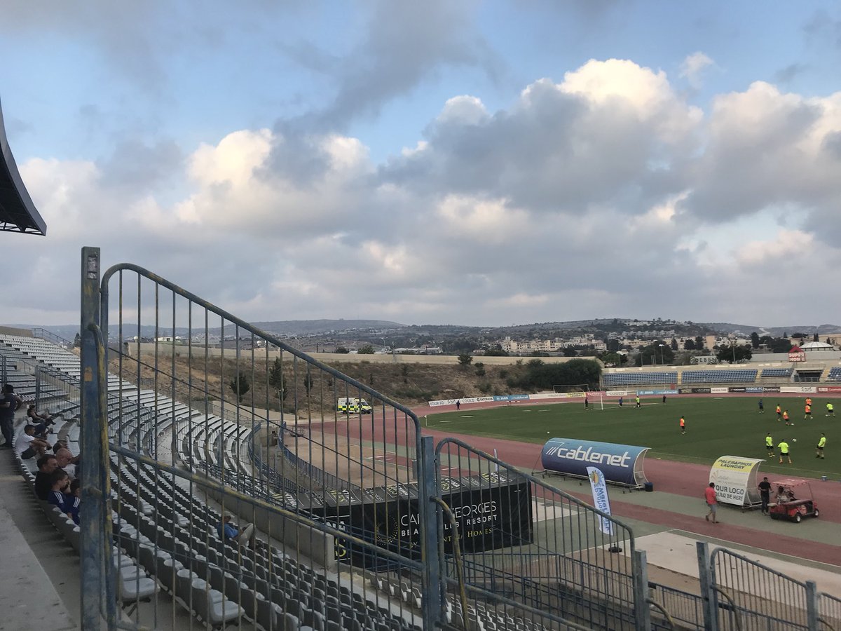 ArRobbo71's tweet photo. Paphos fc v fuck knows 
Stephen Presley’s the manager,I’d shout “fucking traitor” towards him but I’m fucking miles away!!
Better stadia than dens though.
#paphosfc #shantytown #soweto 
#out https://t.co/xBuksIz7o1
