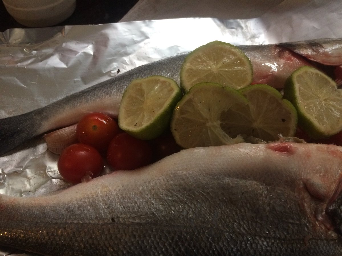 AngelaBare's tweet photo. Cooking tonight #seabass #foilcooking #tomatoes #lemonandlines #garlic #homecooking it smells fab while it’s cooking 🥘 https://t.co/NWlInCsnta