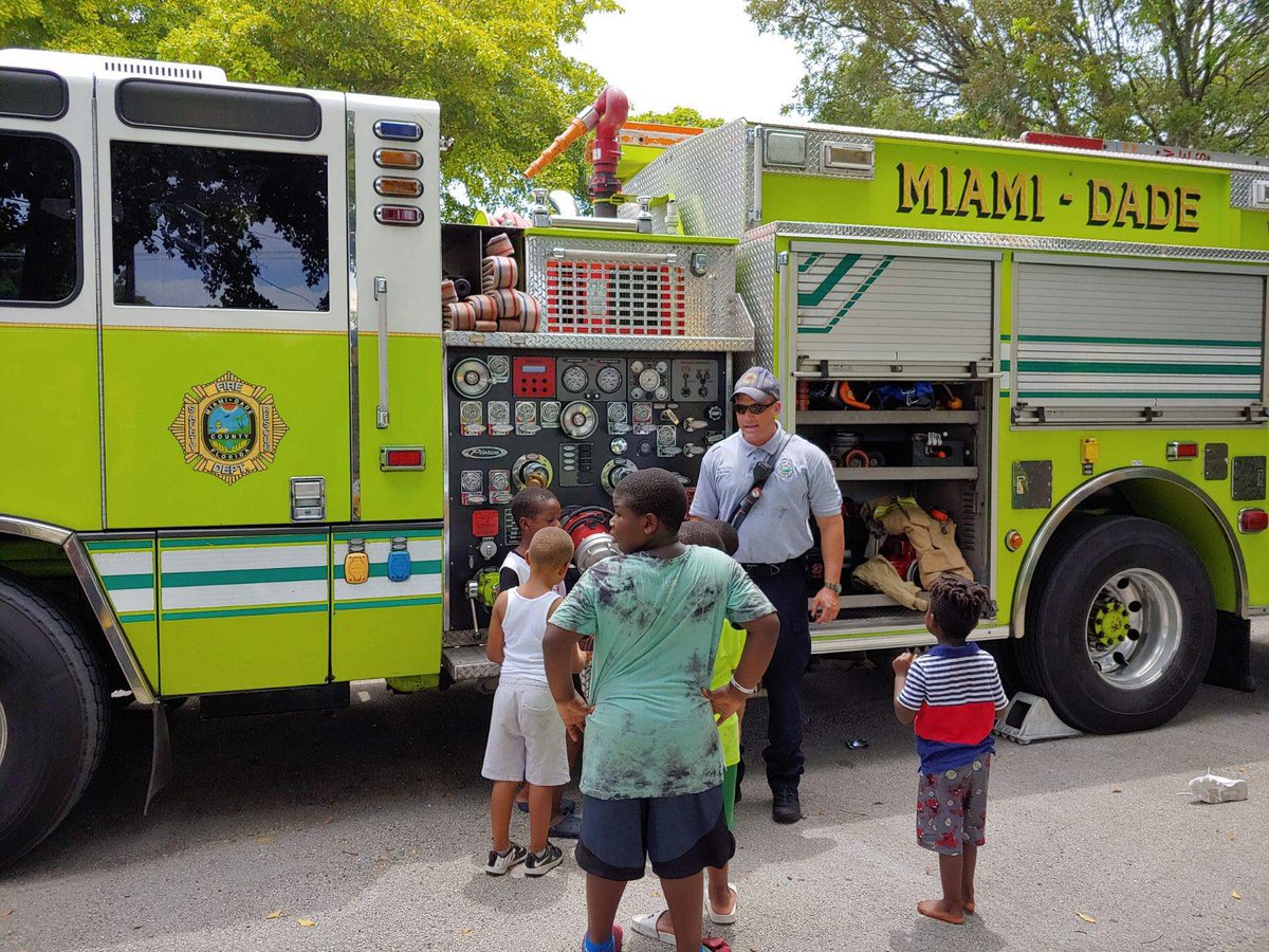 MiamiDadeFire's tweet image. #MDFR #Engine2 FF Billy McCann showing the different functions of a fire truck to kids during a community event today at the Liberty Fellowship of God Church. #MDFRInTheCommunity.