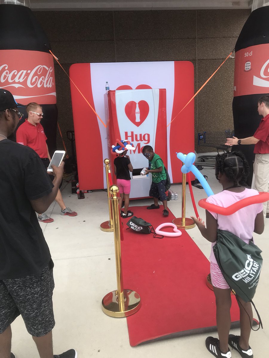 LaurieSLetts's tweet photo. Fun day in Norfolk recognizing military families in partnership with the USO, Coke, Nathan’s and Milo’s. Love the Coke hug machine... give it a hug and it gives you a Coke! #WalmartAction #BetterTogether https://t.co/TPPvcj0Vfx