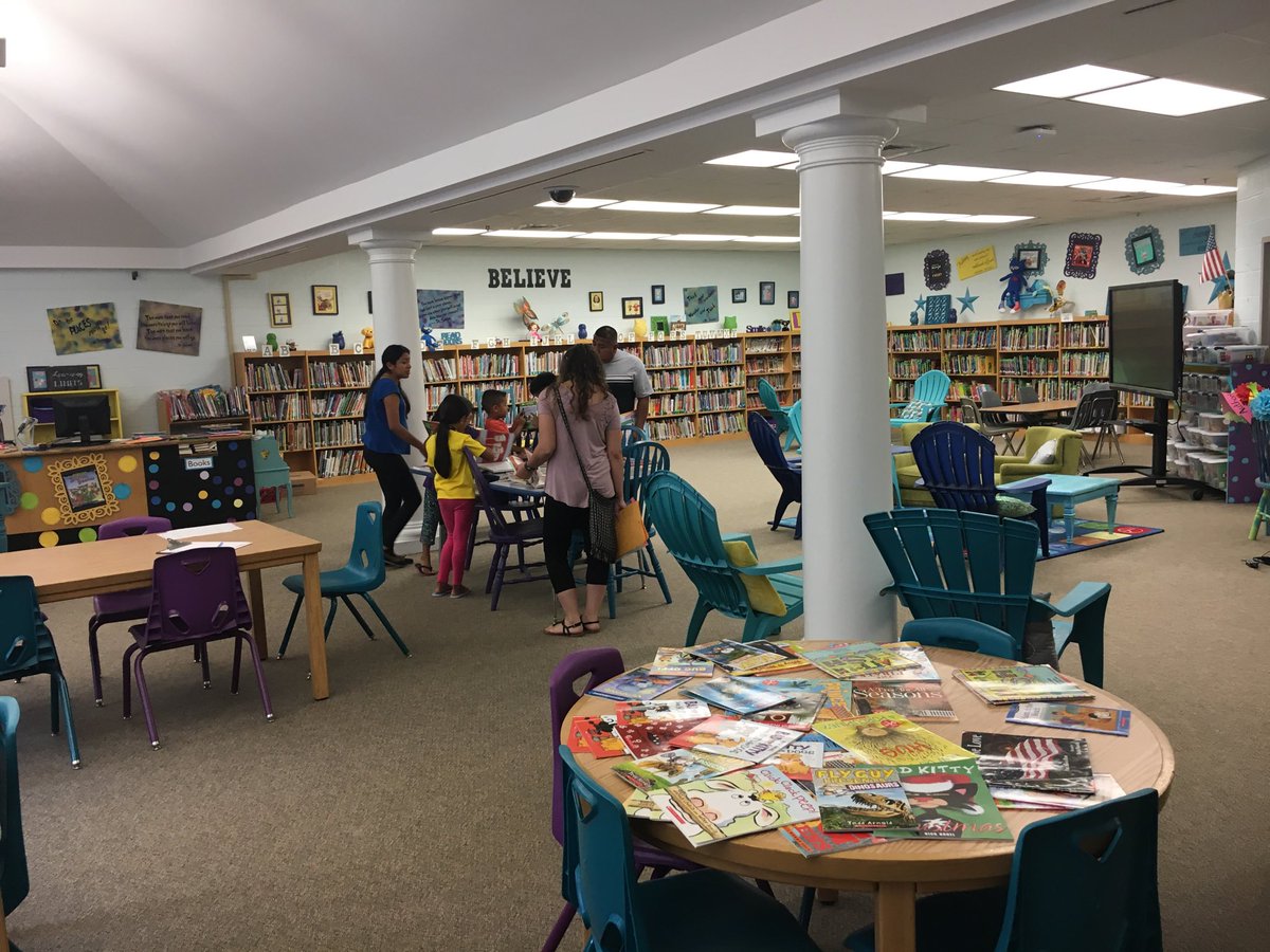 VACDES students enjoy selecting a free book to take home from Meet the Teacher evening. The event continues until 6 p.m. on 8.7.18.