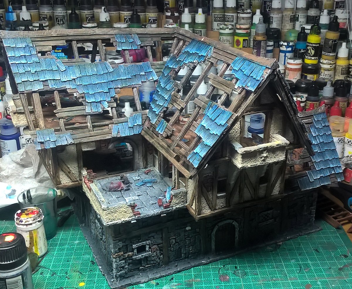 SigurSquirrel's tweet photo. Woah, the cellphone cam makes blues 'pop' under artificial light. Anyway that's the state of things on the Coaching Inn make-over project. #terrain #mordheim #frostgave #miniatures #warmongers #PaintingWarhammer #wip #tabletopworld #wargaming https://t.co/iRSyB4LTGr