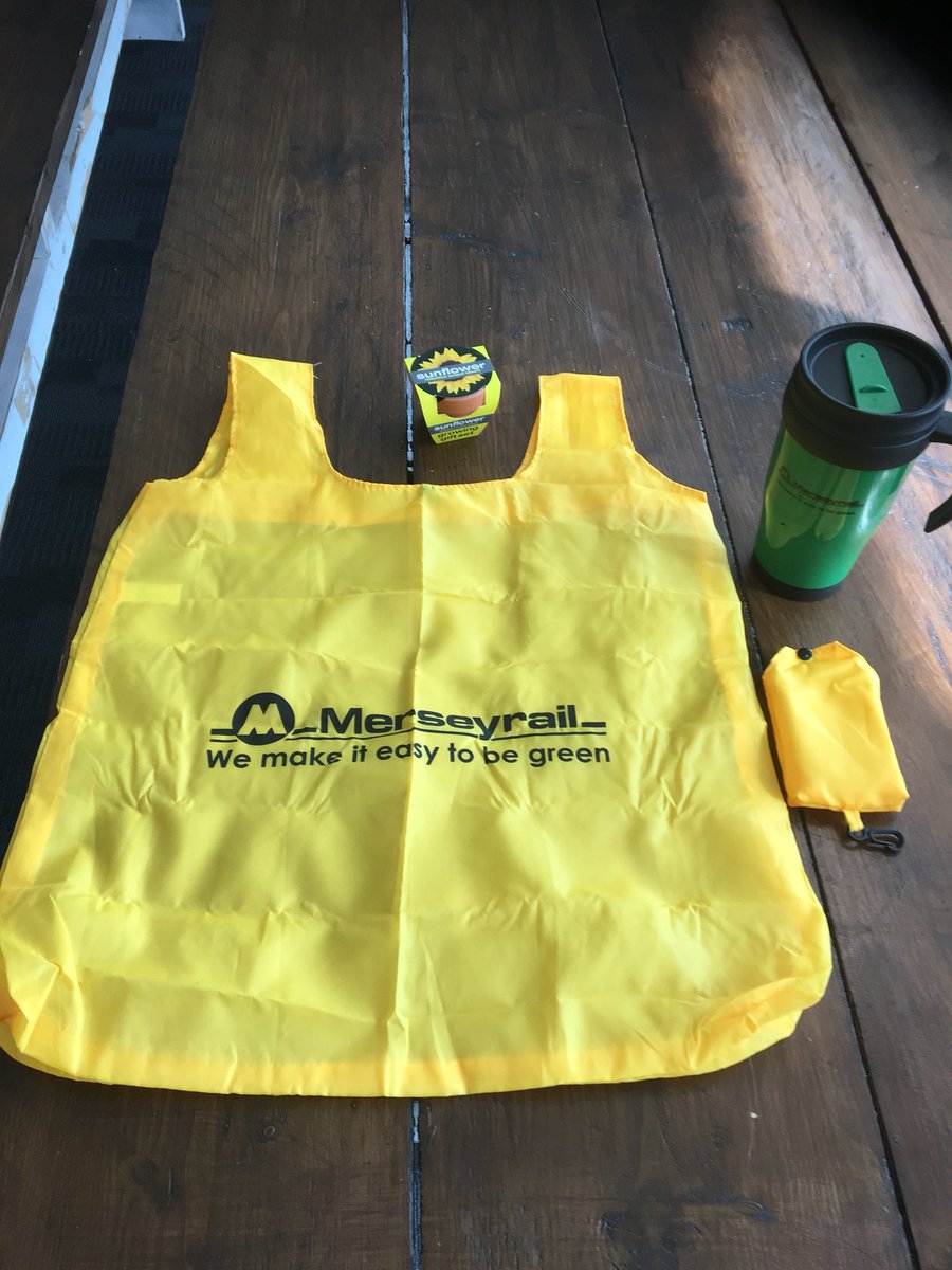 Welcome2Liv's tweet photo. Get to Central. Merseyrail goodies. Foldable bag,travel mug and a sunflower !!!!! https://t.co/e43rr7DMiS