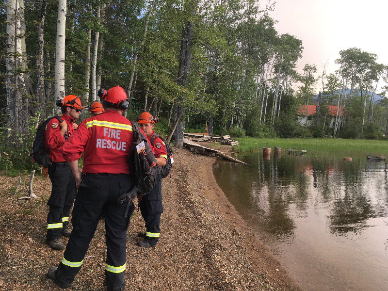 DNVFRS's tweet photo. DNVFRS's Structural Protection Crew working hard to protect structures threatened by the Wildfire currently  burning on the west shore of Babine lake near Smithers, BC. #BCwildfires #fireprotection #firesafety #DNVFRS https://t.co/CdPixOcMdz