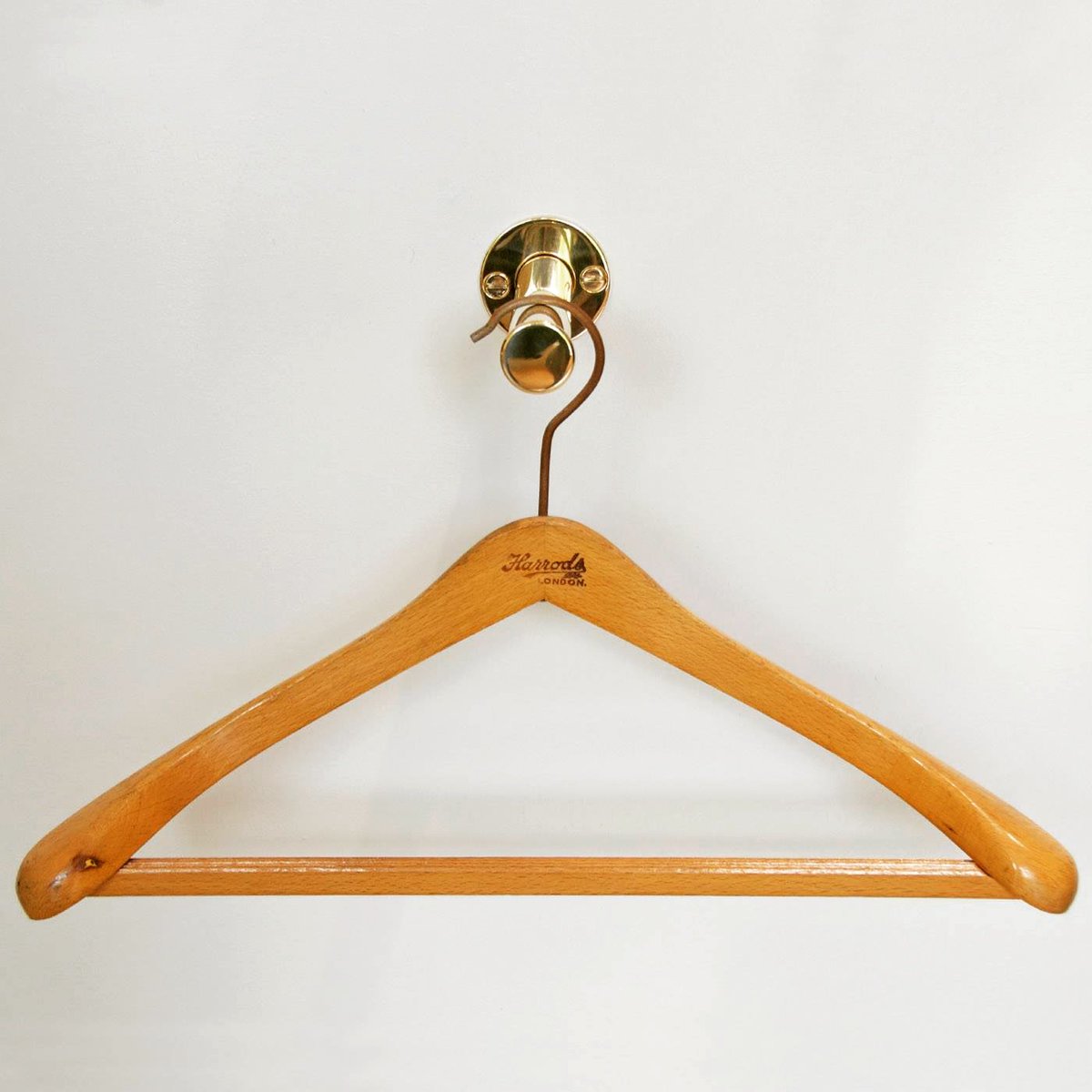 Neat &amp; tidy, what’s not to love! Our valet hook has been created with this in mind. With its retractable design, when you don’t need it, push it back and out of the way! #AndrewNebbettDesigns #polishedbrass #valethook #valethooks #craftsmanship #decor #design #interiordesign