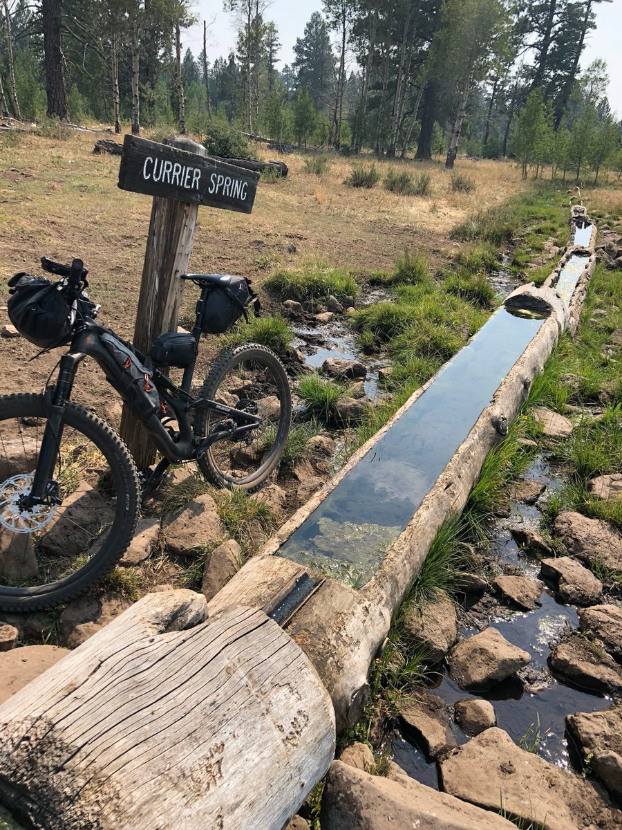 dirtbagdiaries's tweet photo. What's the saying — don’t look a gift horse trough in the mouth? That’s the one we were looking for when Fitz found himself riding on a long, dry stretch of the #OregonTimberTrail. Hopefully it was clean enough! Would you drink it? @iamspecialized @patagonia @DTTBcreate https://t.co/HL2jF2Meoq