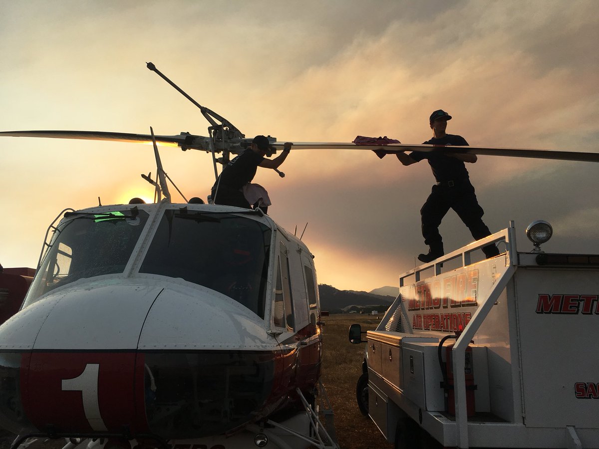 MetroAirOps's tweet photo. Flying through all the smoke and soot #SacramentoMetroFire Copter 1 gets regular cleaning and system checks along with required maintenance while at the #RanchFire #mendocinocomplex #CAWildFires #OneGoalOneFight #MutualAid #HueyUH1N https://t.co/t1tQ9xM5lJ