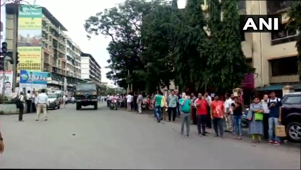 #Mumbai: Locals sprinkle flowers on Mira road area as the convoy carrying mortal remains of Major Kaustubh Prakash Kumar Rane passes through. Rane lost his life in Gurez Sector of J&amp;K on August 7.