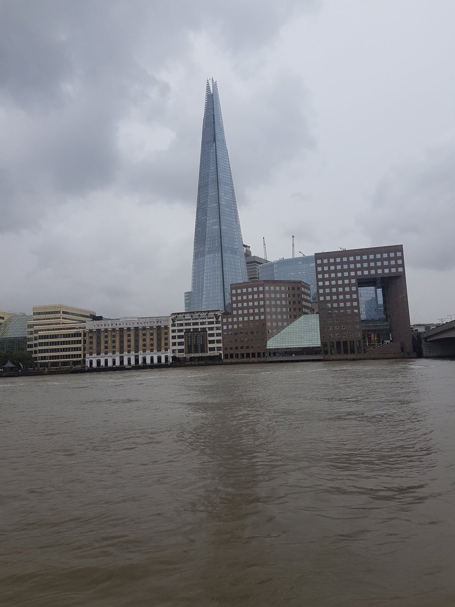 Full length wet pointy thing with muddy puddle in front #londontourguide