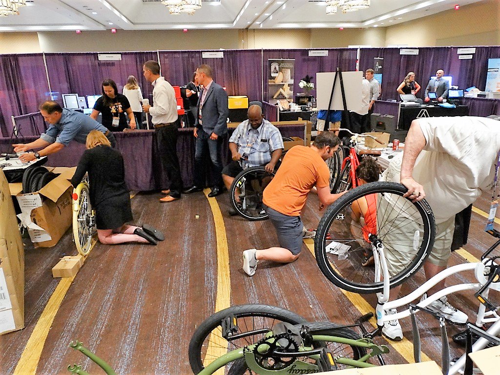 nacconcessions's tweet photo. NAC Expo attendees build bikes for NOLA teens. #nacexpo #wherefoodmeetsfun @GrowDatNOLA https://t.co/NibGFBEnWV