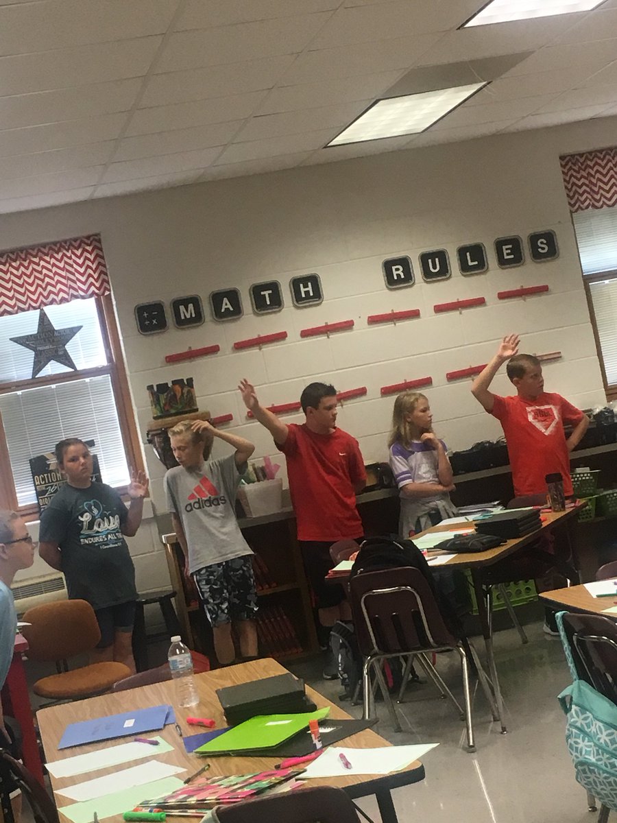 OES 6th graders discussing area and perimeter using floor tiles!