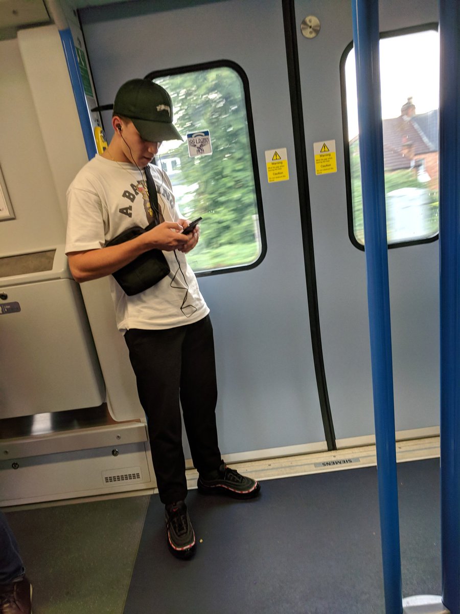 Deric's tweet photo. @TLRailUK this chap is on the train ten minutes before at Albans just sticking to stockers on the train windows https://t.co/2c8F8EE8us