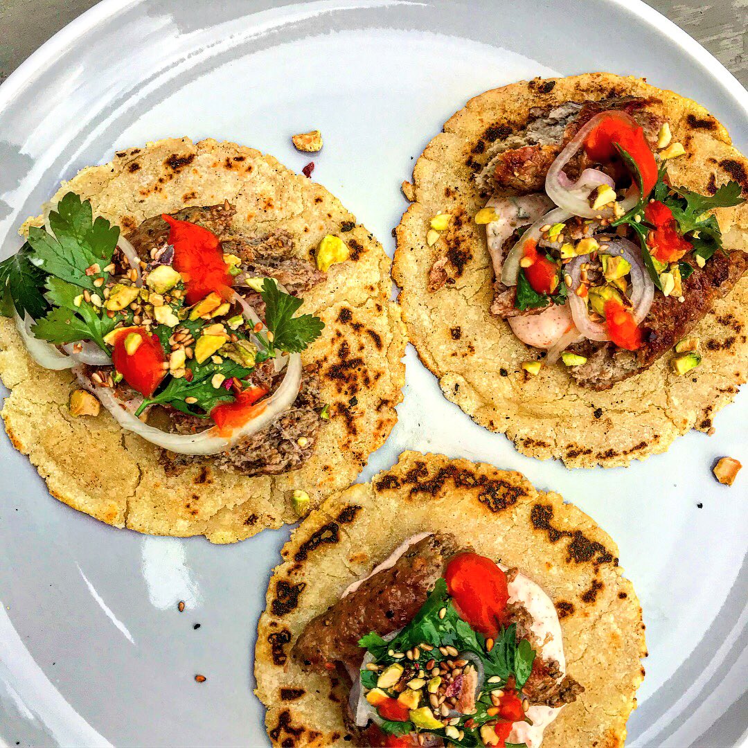 andylownslow's tweet photo. Lamb kofte tacos with pickled onion and parsley salad, pistachio, sesame, tzatziki, fermented chilli. Cooked over whiskey oak logs on the @thuros_UK 🔥 https://t.co/SA1gM1wzJ1