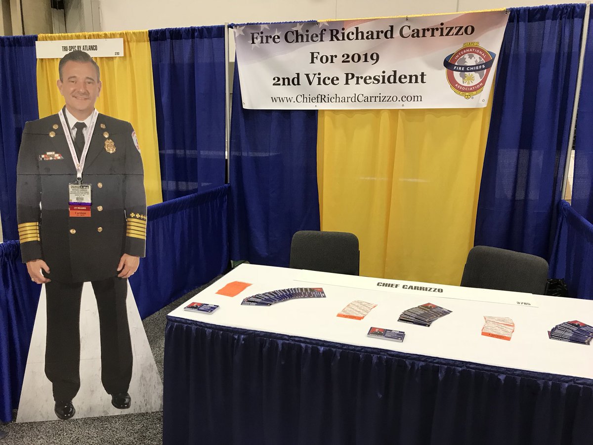 SPFPDFireChief's tweet photo. He really is in the building. Be sure to stop by Booth 3785 and pick up a name ribbon to so your support. Also be sure to take a photo with #FlatRich and post it! Thank you to @IAFCPresident for stopping by already and getting those pix! #FRI2018 https://t.co/N1LST1O32P