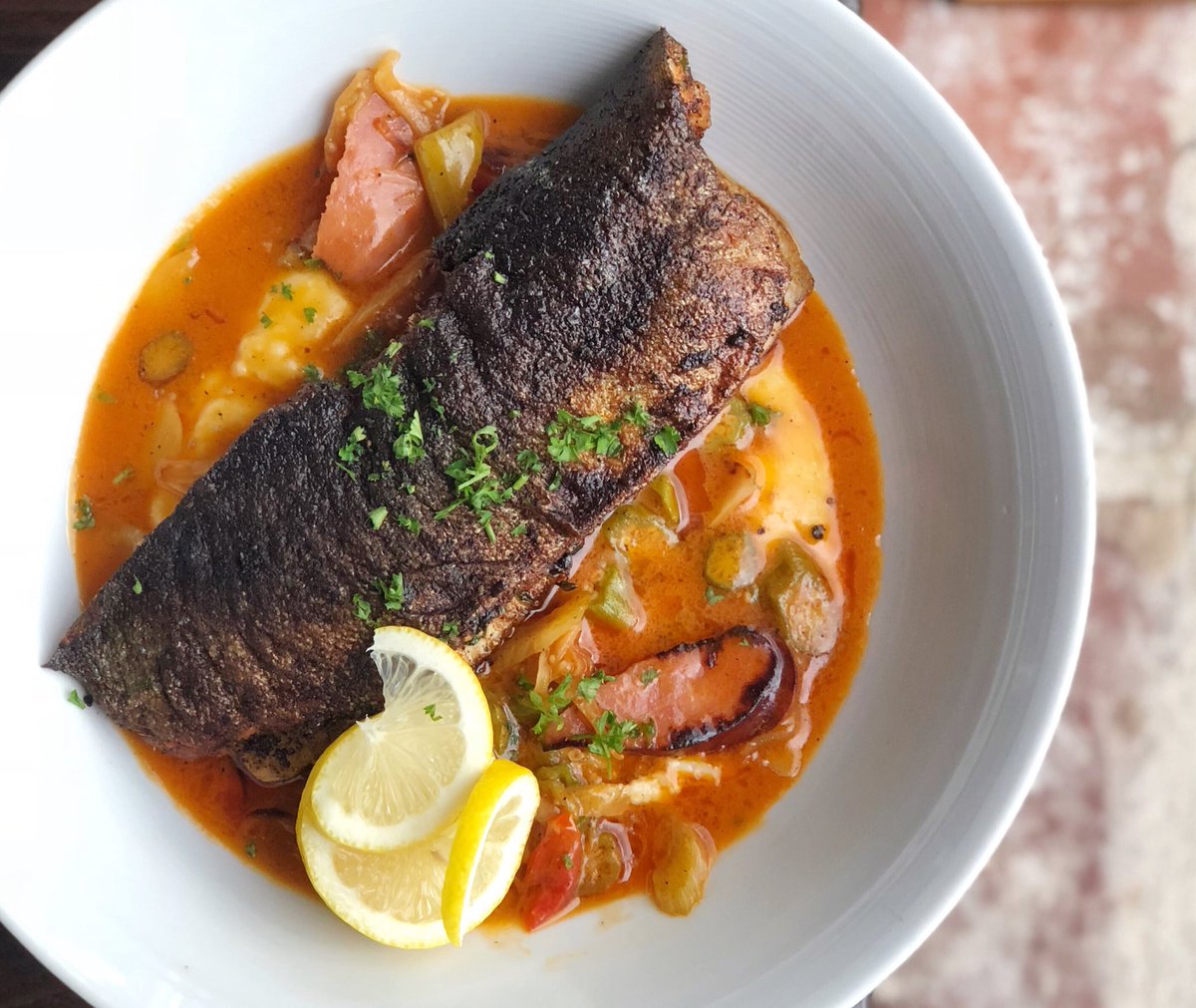 Seared Rainbow Trout • spicy tomato & andouille ragout, okra, gouda grits. #MarketFish