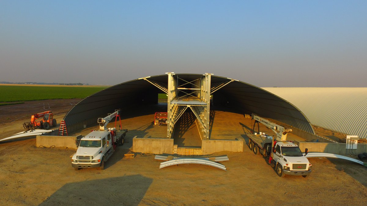 cpfarmsltd's tweet photo. The @meridianmfg super single structure near completion. #fatkid #spudhouse I can't believe the efforts of the @SWMWdesignco crew in this incredible heat we are having lately. They understand we have a crop of @AlbertaPotatoes that needs a winter home! #IVI and urethane left. https://t.co/p6L9HDF5fF
