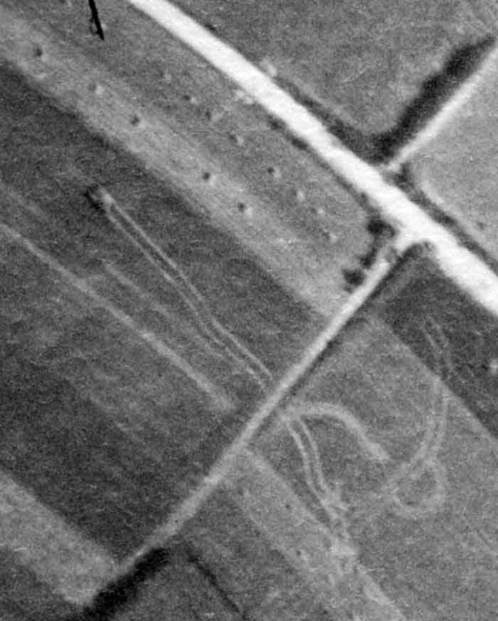 This image is taken to the SW of the field where the battlegroup was located. A German tank (likely a Panther) faces the rectangular field. It likely helped destroy the Shermans shown in the previous image, and has now turned its attention to the main Canadian position.