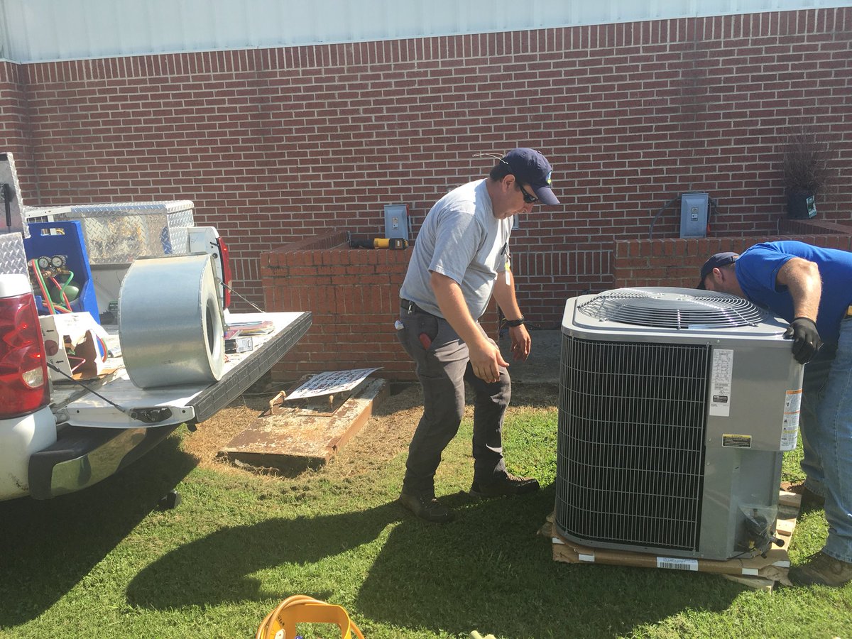 FCPS_Facilities's tweet photo. Maintenance guys Mike &amp; Ray in “Overdrive” installing a new A/C unit for the office at West.
#GuysWorkingHard
#WeDo4TheKids! @suptking https://t.co/VZI0jXkdNn